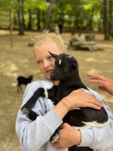 Freya who has ed holding a goat